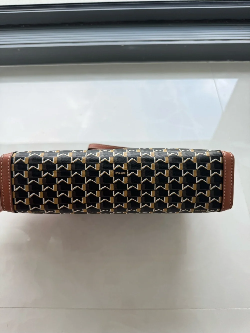Moynat M Nomad Pouch (brown M monogram canvas with leather trim and wrist strap)